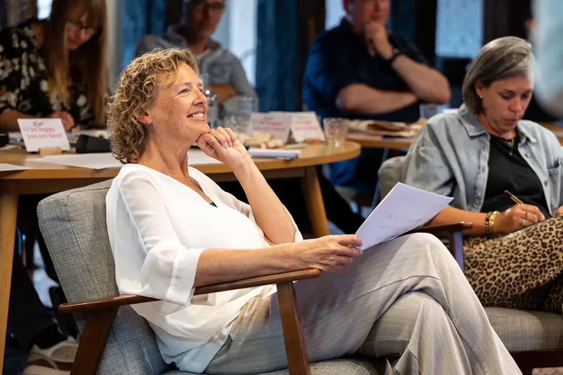 A participant laughing during the training