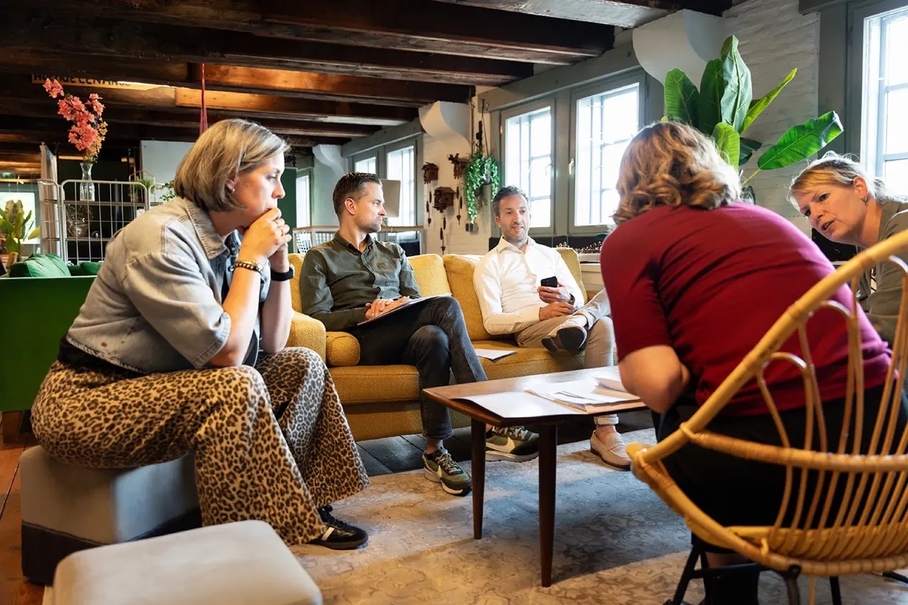 Participants talking on the sofa