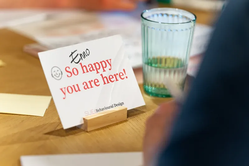 A card on the table that reads So happy you are here