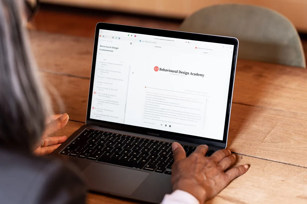 A learner following The Art of Influence online on a laptop